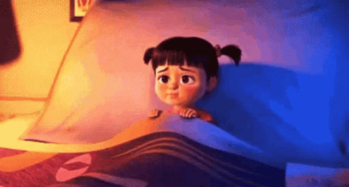 an image of the littlest girl from the Despicable Me movies, Agnes - being scared during her bedtime and ducking under the covers"